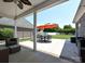 Covered patio provides ample space for outdoor dining and relaxation, with views of the landscaped backyard at 4562 Lanstone Sw Ct, Concord, NC 28027