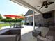 The covered patio provides ample space for outdoor dining and relaxation, featuring stylish furnishings at 4562 Lanstone Sw Ct, Concord, NC 28027