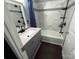 Bathroom featuring a modern vanity, a stylish bathtub with shower, and elegant tile work for a spa-like feel at 4845 Midway Sand Rd, Hickory, NC 28601