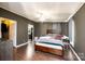 Bedroom with wood floors, ceiling fan, and entry to bath and walk-in closet at 4845 Midway Sand Rd, Hickory, NC 28601