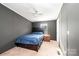 Bedroom with carpet, a ceiling fan, and a window bringing in natural light at 4845 Midway Sand Rd, Hickory, NC 28601