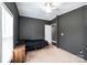Bedroom featuring neutral carpet, ceiling fan, and a black bedspread at 4845 Midway Sand Rd, Hickory, NC 28601