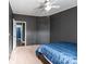 Comfortable bedroom with a ceiling fan and door to the en-suite bathroom at 4845 Midway Sand Rd, Hickory, NC 28601