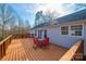 Spacious wooden deck with table and chairs, perfect for outdoor entertaining at 4845 Midway Sand Rd, Hickory, NC 28601