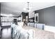 Open concept dining room view of kitchen with white cabinets and stainless steel appliances at 4845 Midway Sand Rd, Hickory, NC 28601
