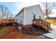 Back exterior shot of the home and deck, featuring brick and siding at 4845 Midway Sand Rd, Hickory, NC 28601