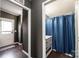 Hallway view leading to a bathroom featuring a blue shower curtain at 4845 Midway Sand Rd, Hickory, NC 28601