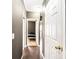 Hallway with wood floors leading to a bedroom with a black bedspread at 4845 Midway Sand Rd, Hickory, NC 28601