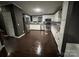 Bright kitchen with stainless appliances, white cabinetry, and wood flooring at 4845 Midway Sand Rd, Hickory, NC 28601