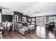 Open-concept living room boasts wood floors, deck access, and modern furniture at 4845 Midway Sand Rd, Hickory, NC 28601