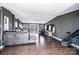 Inviting living room with hardwood floors, ceiling fan, and access to the outdoor deck at 4845 Midway Sand Rd, Hickory, NC 28601