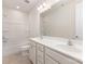 Bright bathroom featuring a double sink vanity, a large mirror, and a shower/tub combo at 5065 Watersail Way, Clover, SC 29710