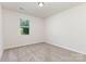 Bright bedroom with neutral carpet, white walls, and natural light from a single window at 5065 Watersail Way, Clover, SC 29710