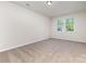 Bright bedroom with neutral carpet, white walls, and natural light from the double window at 5065 Watersail Way, Clover, SC 29710