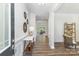 Inviting entryway showcasing hardwood floors, decorative wall art, and an open view to the spacious living areas at 5065 Watersail Way, Clover, SC 29710