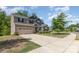 Charming two-story home with neutral siding, a two-car garage, and a well-manicured front lawn on a sunny day at 5065 Watersail Way, Clover, SC 29710