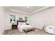Relaxing primary bedroom with soft carpet, neutral paint, and a tray ceiling at 5065 Watersail Way, Clover, SC 29710