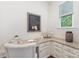 Bright office space featuring granite counters, white cabinets and a large window at 5065 Watersail Way, Clover, SC 29710