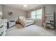 Bright Bedroom with a crib, cozy chair, and soft pastel accents at 5135 Winding Brook Rd, Charlotte, NC 28226