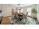 Formal dining room with wainscoting, modern chandelier, and ample seating at 5135 Winding Brook Rd, Charlotte, NC 28226