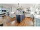Spacious kitchen with a large island, white cabinets, and modern appliances at 5135 Winding Brook Rd, Charlotte, NC 28226