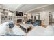 Spacious living room featuring a fireplace, built-in shelves, and hardwood floors at 5135 Winding Brook Rd, Charlotte, NC 28226