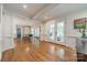 Open floor plan featuring hardwood floors, a dining space, and access to the patio at 5135 Winding Brook Rd, Charlotte, NC 28226