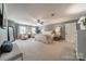 Expansive primary bedroom suite with sitting area and luxurious furnishings at 5135 Winding Brook Rd, Charlotte, NC 28226