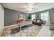 Comfortable home office with a leather couch, large desk, and stylish decor at 5135 Winding Brook Rd, Charlotte, NC 28226