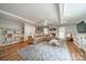 Inviting playroom with a patterned rug, cozy sectional, and plenty of storage at 5135 Winding Brook Rd, Charlotte, NC 28226
