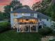 A spacious two-story house featuring a large screened-in porch perfect for outdoor entertainment at 5135 Winding Brook Rd, Charlotte, NC 28226