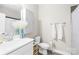 Clean bathroom showcasing a marble sink, toilet, and a decorative vase of pampas grass at 5648 Woodard St, Charlotte, NC 28269
