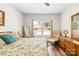 Comfortable bedroom with a serene view and natural light from a large window at 5648 Woodard St, Charlotte, NC 28269