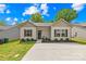 Charming single-story home with a well-manicured lawn, concrete driveway, and welcoming front entrance at 5648 Woodard St, Charlotte, NC 28269