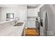 Modern kitchen with stainless steel appliances and an eat-in breakfast bar at 5648 Woodard St, Charlotte, NC 28269