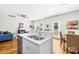 Open-concept kitchen with stainless steel appliances, granite countertops, and a seamless transition to the living area at 5648 Woodard St, Charlotte, NC 28269
