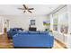 Cozy living room with comfortable seating, large windows, and a ceiling fan at 5648 Woodard St, Charlotte, NC 28269