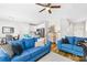 Bright living room features hardwood floors, ceiling fan, and comfortable seating at 5648 Woodard St, Charlotte, NC 28269