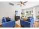 Bright and airy living room with comfortable seating and a ceiling fan at 5648 Woodard St, Charlotte, NC 28269