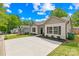 A row of attractive single-story homes, each with a well-maintained yard and a modern design at 5648 Woodard St, Charlotte, NC 28269