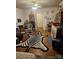 Eclectic living room featuring hardwood floors and unique decor, including a zebra-striped rug at 621 Benton St, Monroe, NC 28110