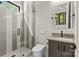 Modern bathroom featuring a glass enclosed shower with light-grey tiling and dual-flush toilet at 624 Heather Ln, Charlotte, NC 28209