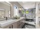 Contemporary bathroom featuring a walk-in shower, soaking tub, dual sink vanity, and marble floors at 624 Heather Ln, Charlotte, NC 28209