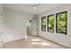 Bright, airy bedroom with hardwood floors and three large windows at 624 Heather Ln, Charlotte, NC 28209