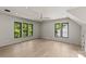 Expansive bonus room with large windows, hardwood flooring, and recessed lighting at 624 Heather Ln, Charlotte, NC 28209