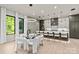 Stylish dining area adjacent to the kitchen features modern lighting and comfortable seating at 624 Heather Ln, Charlotte, NC 28209