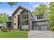 Stunning home with a modern design, two-car garage, eye-catching windows and professionally landscaped front yard at 624 Heather Ln, Charlotte, NC 28209