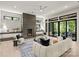Bright and airy living room with floor-to-ceiling windows and modern fireplace at 624 Heather Ln, Charlotte, NC 28209