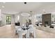 Open-concept living room featuring modern lighting, fireplace and hardwood floors at 624 Heather Ln, Charlotte, NC 28209