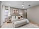 Well-lit main bedroom features large windows, recessed lighting, ceiling fan, and neutral decor at 624 Heather Ln, Charlotte, NC 28209